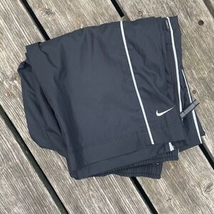 Nike black splash track sweat pants, Has reflective pipping and zip pockets
